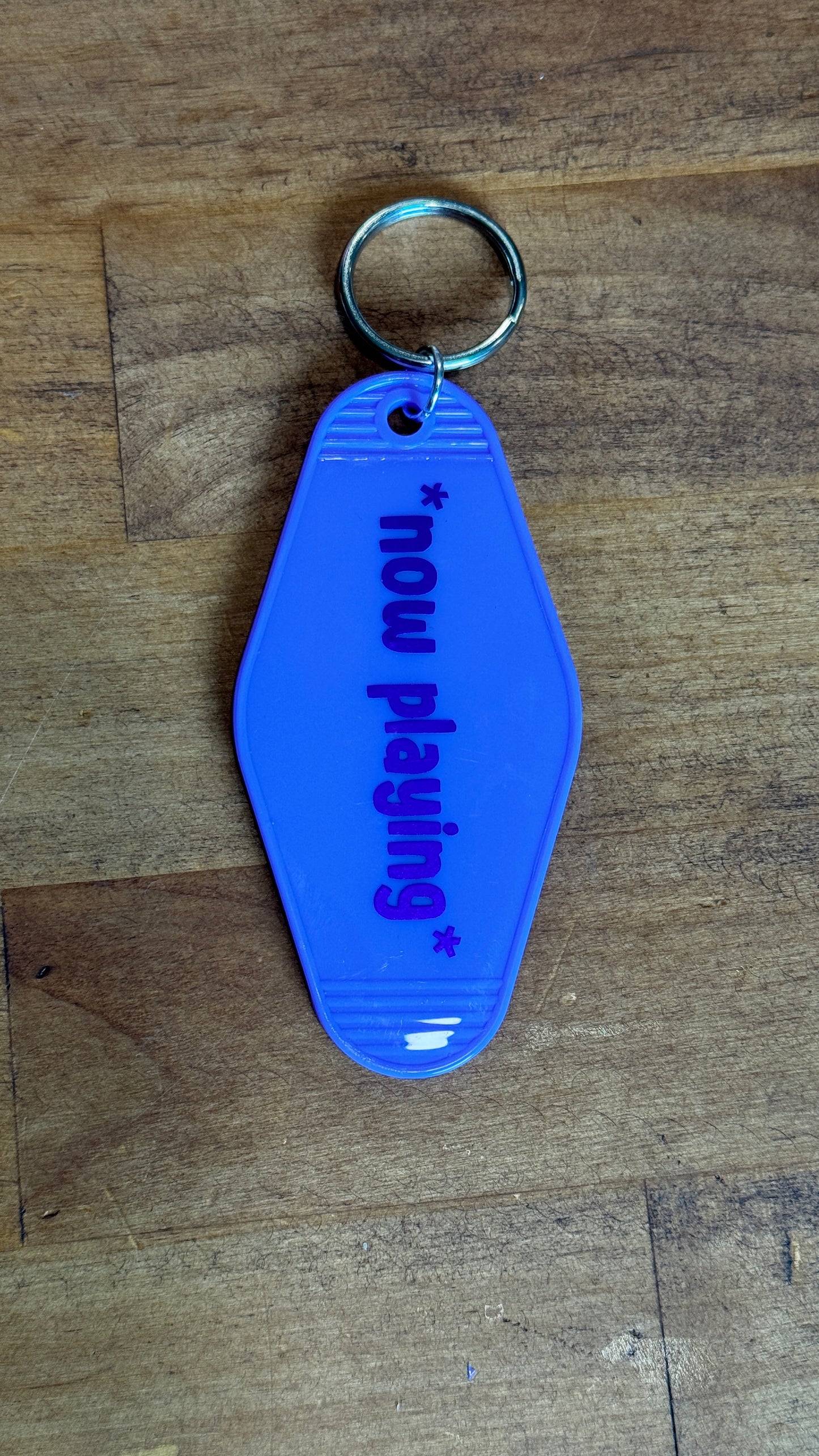 Hotel keychain: Now Playing